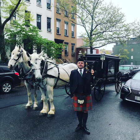Bagpiper outside of Sacred Hearts & St. Stephen in Brooklyn with Horse Drawn Carriage