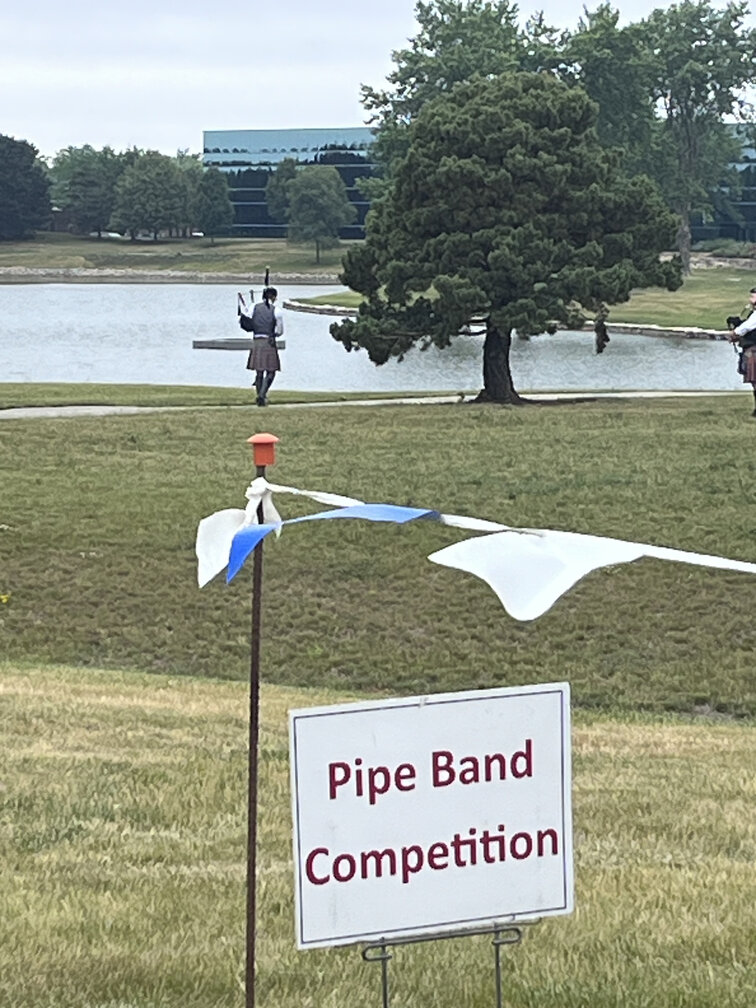 Bagpiper playing at a bagpipe Competition.